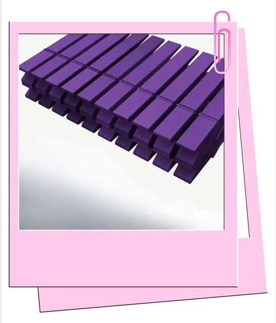 Purple wooden pegs