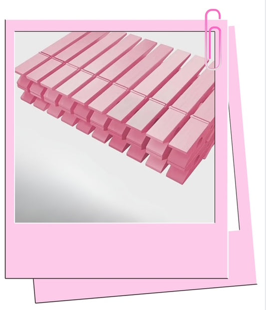 Pink wooden pegs