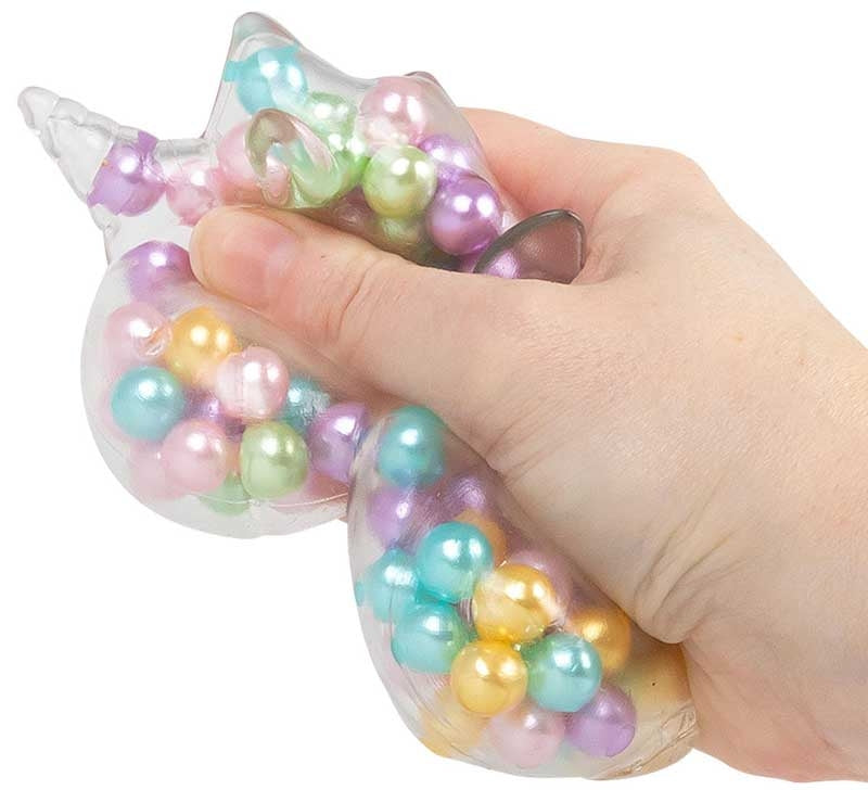 Scrunchems ASMR Rainbow Unicorn clear unicorn squishy filled with pastel beads, shown being gently squeezed