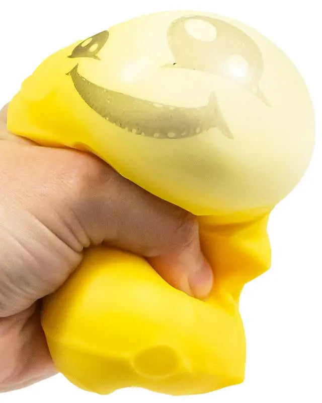 Scrunchems Squeezy Cheese sensory toy with cute face and dimpled cheese holes